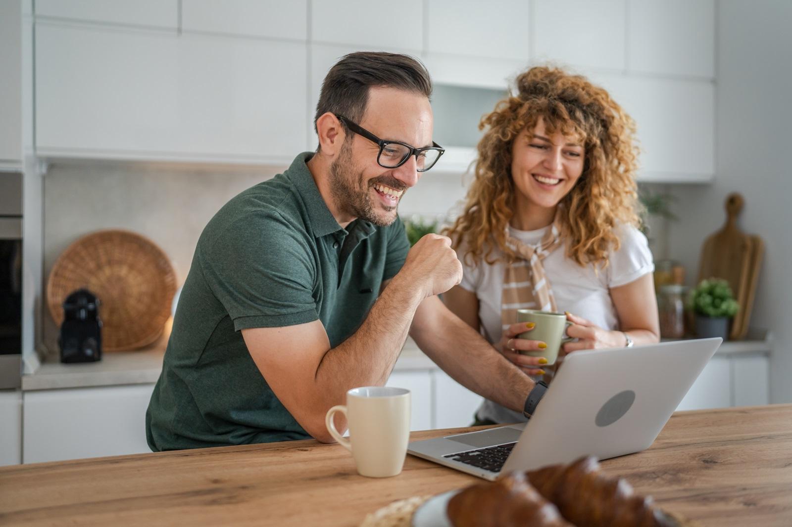 A couple researches home improvement projects online that they will fund using a personal consumer loan.